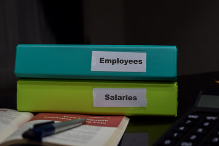 folders with the label Employees and Salaries. Business management concept