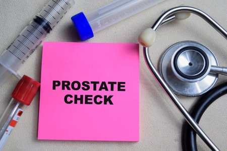 Concept of Prostate check write on sticky notes isolated on Wooden Table. stethoscope and pharmaceuticalsの写真素材