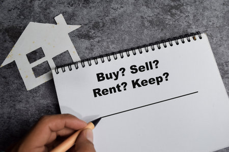 Concept of Buy, Sell, Rent, Keep write on book isolated on Wooden Table.の写真素材