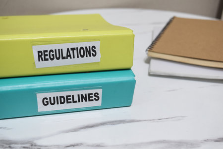 folders with the label Regulations and guidelines. Business management conceptの写真素材