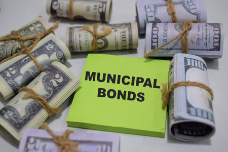 Concept of Municipal Bonds write on sticky notes isolated on Wooden Table.
