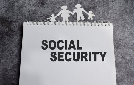 Concept of Social security write on book isolated on Wooden Table.の写真素材