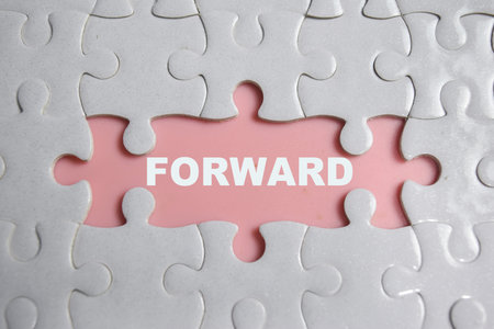 Piece of jigsaw puzzle and word forward.の写真素材