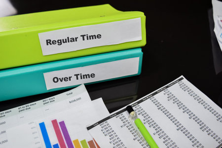Folders with the label Regular time and over time. Business management conceptの写真素材