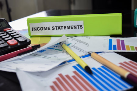 Folders with the label income statements. Business management conceptの写真素材