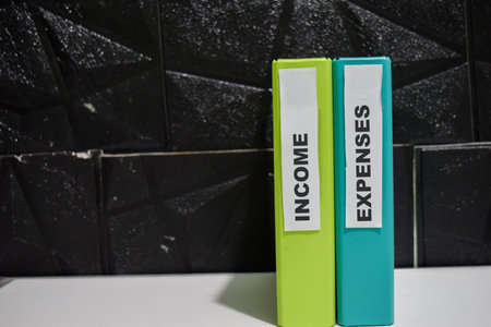 Folders with the label income and expenses. Business management conceptの写真素材