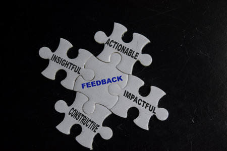 piece of jigsaw puzzle with word feedback with keywords. Business and finance concept