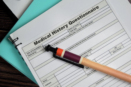 Concept of Medical history questionnaire form write on document isolated on Wooden Table.