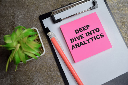 Concept of Deep dive into analytics write on sticky notes isolated on Wooden Table.の写真素材