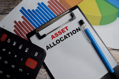 Concept of Asset allocation write on clipboard isolated on Wooden Table.