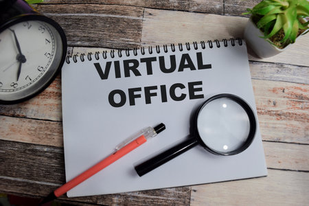 Concept of Virtual office write on book isolated on Wooden Table.の写真素材