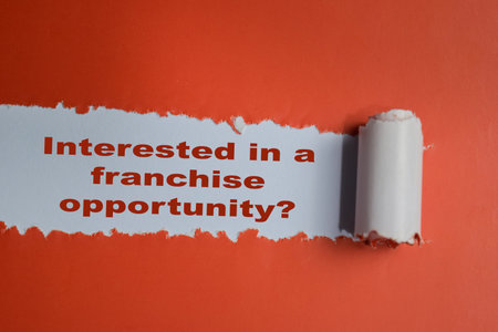 Interested in a franchise opportunity? Text written in torn paperの写真素材