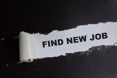 Find new job Text written in torn paper