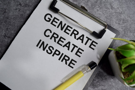 Concept of Generate create inspire write on clipboard isolated on Wooden Table.の写真素材