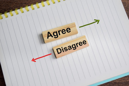 Agree and disagree on a notepad. Business and finance conceptの写真素材