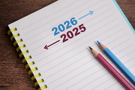Concept of moving forward from 2025 to 2026 write on book isolated on Wooden Table.の写真素材