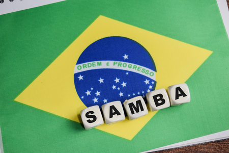 Samba on stacked wooden cubes with Brazil flag on the table.