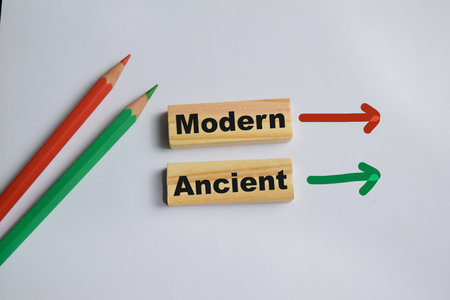 Modern and ancient on stacked wooden cubes on the table. Symbolizing contrast and cultural...