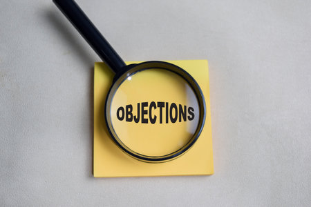 Concept of objections write on sticky notes isolated on Wooden Table.