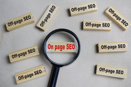 Two words on page SEO or off-page SEO. Choose on page SEO on stacked wooden cubes on the table. Business and finance conceptの写真素材