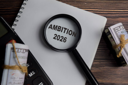 Concept of ambition write on book with keywords isolated on Wooden Table.の写真素材