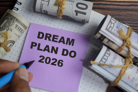 Concept of dream plan do 2026 write on sticky notes isolated on Wooden Table.の写真素材
