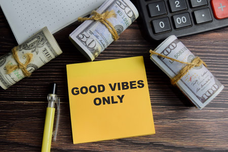 Concept of good vibes only write on sticky notes isolated on Wooden Table.の写真素材
