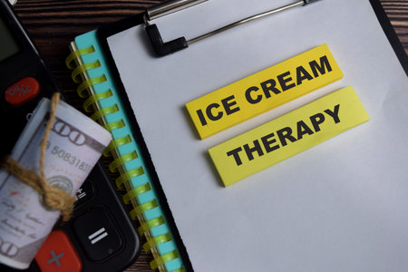 Concept of ice cream therapy write on sticky notes isolated on Wooden Table.の写真素材