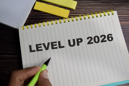 Concept of level up 2026 write on book with keywords isolated on Wooden Table.の写真素材