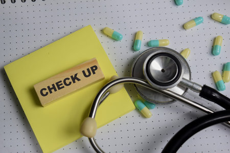 Check up on stacked wooden cubes on the table.の写真素材