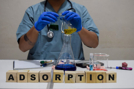 A healthcare professional conducts adsorption experiments in a lab. scientific research concept