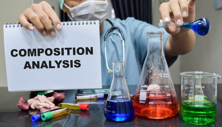 A laboratory technician performs a composition analysis with colorful chemical. scientific research...