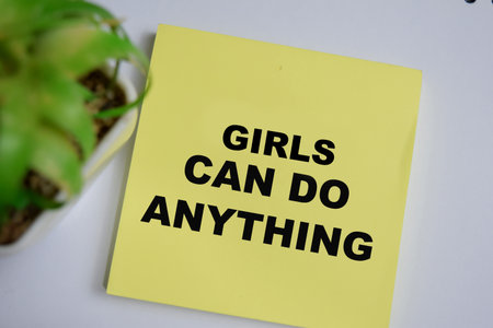 Concept of girls can do anything write on sticky notes isolated on Wooden Table.の写真素材