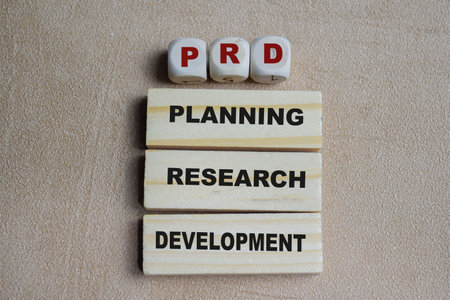 PRD - Planning Research Development stacked wooden cubes on the table.の写真素材