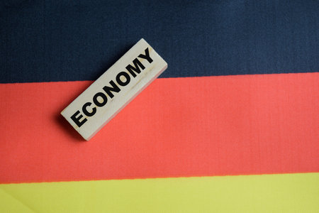 Economy on stacked wooden cubes with Germany flag. Business and finance conceptの写真素材