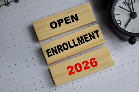 Open enrollment 2026 stacked wooden cubes on the table.の写真素材