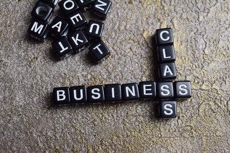Concept of business class words arranged with on letter blocks.の写真素材