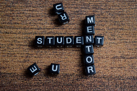 Concept of mentor and student words arranged with on letter blocks.の写真素材