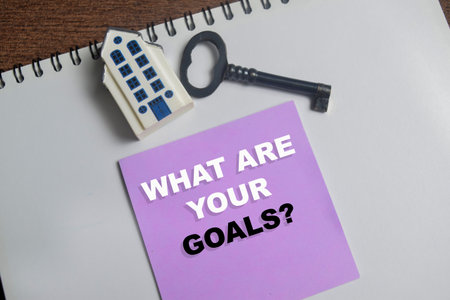 Concept of what are your goals write on sticky notes isolated on Wooden Table.の写真素材