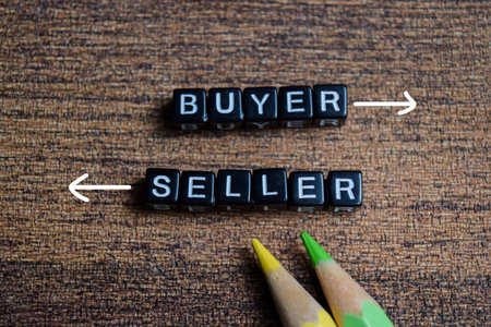 Concept of buyer and seller words arranged with wooden letter blocks.の写真素材