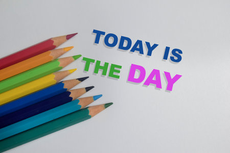 Concept of today is the day write on book isolated on Wooden Table.の写真素材