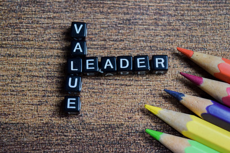 Concept of value and leader words arranged with on letter blocks.
