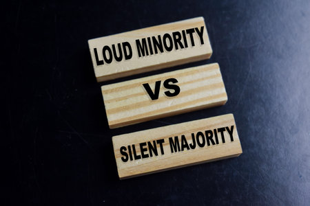 Concept of text loud minority vs silent majority on wooden blocks.