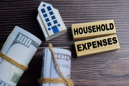 Concept of text household expenses on wooden letter blocks.