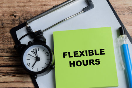 Concept of flexible hours write on sticky notes isolated on Wooden Table.