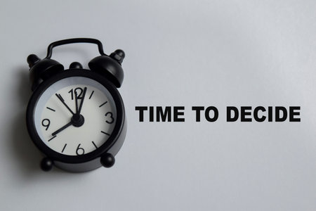 Concept of time to decide write on book isolated on Wooden Table. Representing decision making,...