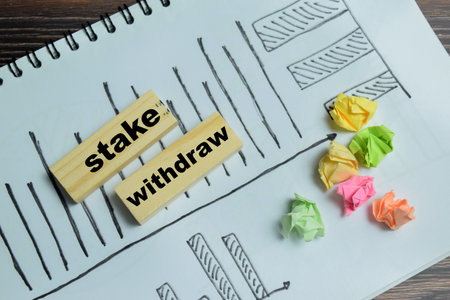 Concept of text stake withdraw on wooden blocks.