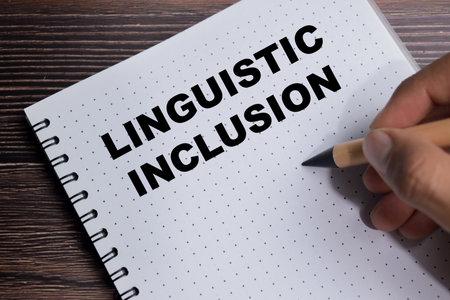 Concept of linguistic inclusion write on book isolated on Wooden Table. For diversity and equitable...