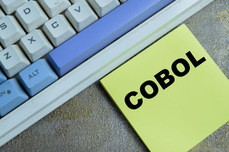 Concept of COBOL - Common-Business Oriented Language programming write on sticky notes isolated on...