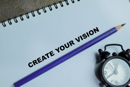 Concept of create your vision write on book isolated on Wooden Table. A process of nurturing and...